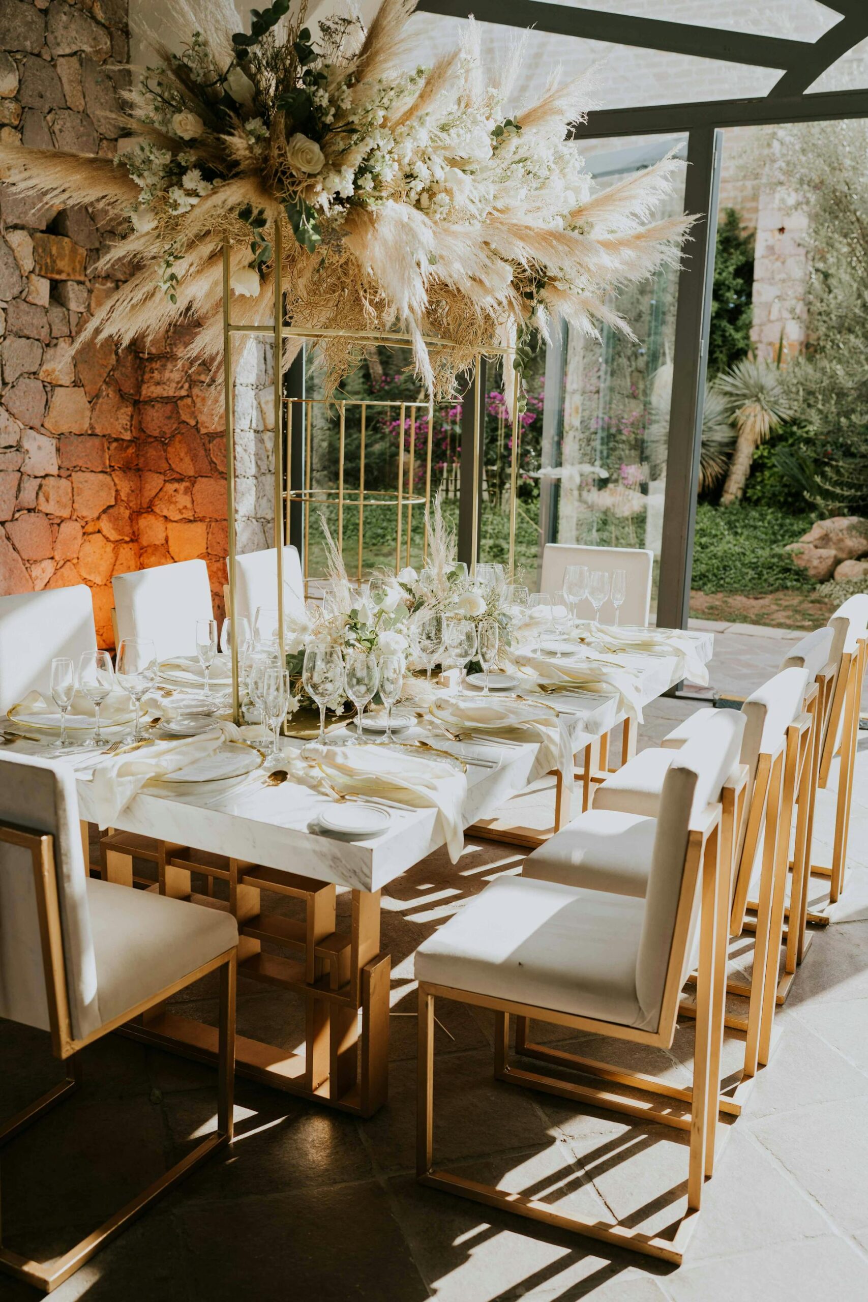 A beautifully decorated table setting in a wedding venue, showcasing in-house catering and decor specialists.